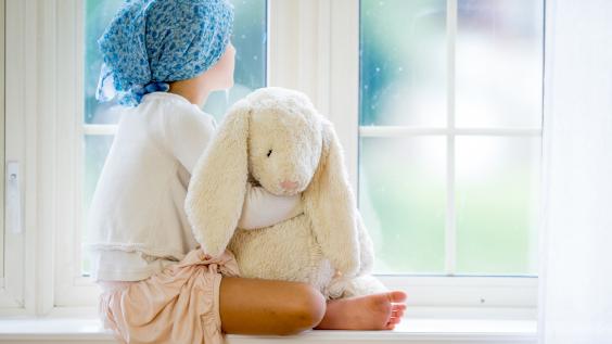 Child staring out of a window