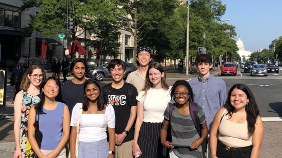 Students from the D.C. Interns program (2022 cohort) pose with the U.S. capitol in the background