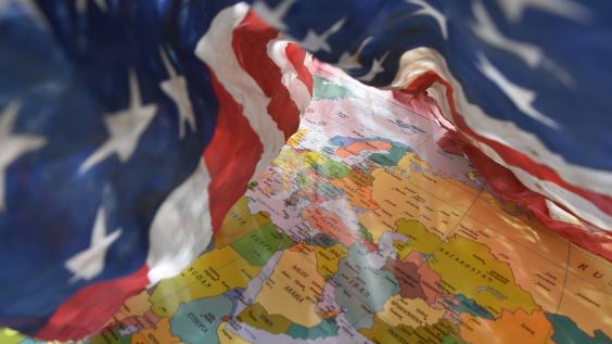 US flag drapes around Middle East regional map