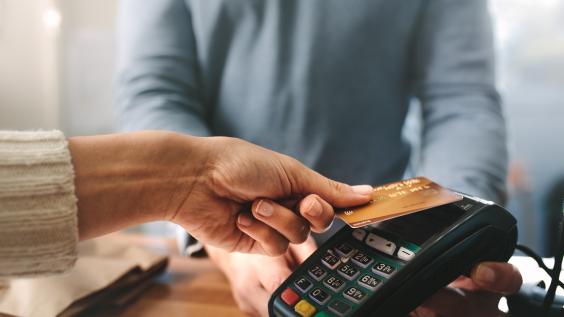 A person pays with credit card.