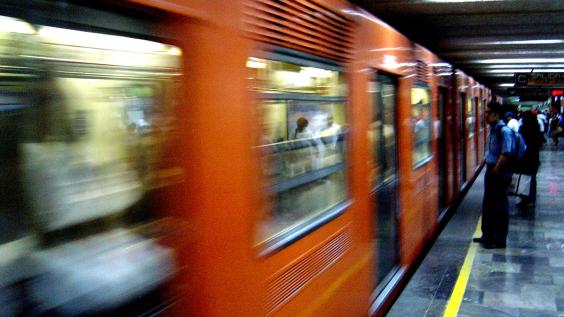 People wait for the subway in Mexico City.