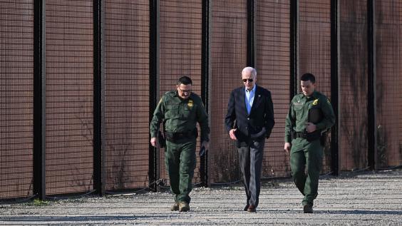 President Biden walks along US border wall