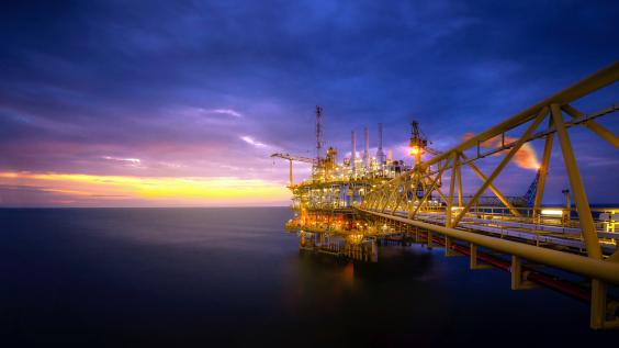 Offshore oil platform at sunrise/sunset