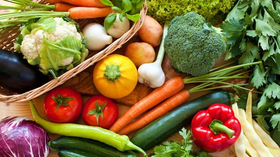 Table full of fresh vegetables and produce
