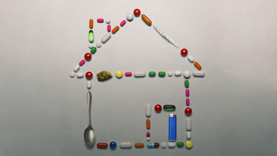 Various drug paraphernalia form the shape of a house