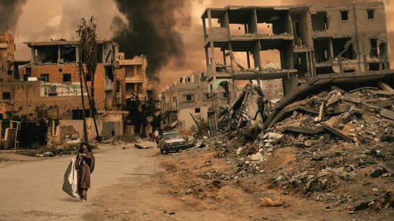 Walking in destroyed city, a little girl seeks shelter