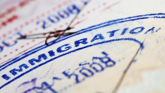 Immigration stamp inside a passport