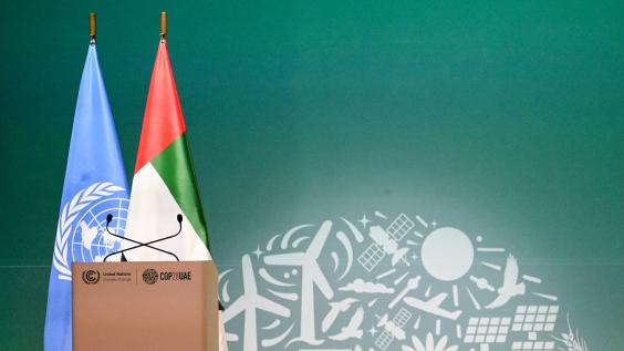 View of a lectern with flags of the United Nations and the United Arab Emirates