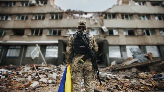 Ukrainian military woman with the Ukrainian flag 