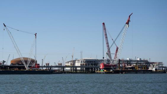 Construction cranes are seen near the construction site of the Venture Global LNG plant in Plaquemines Parish south of New Orleans, Louisiana on October 17, 2023.