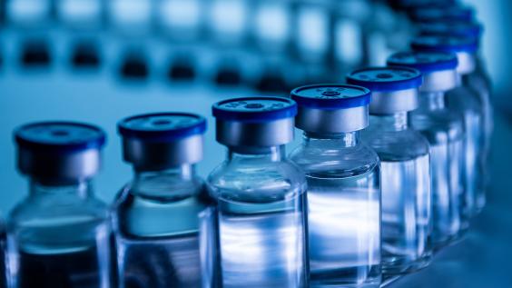 Group of Vaccine bottles. Medicine in ampoules. Glass vials for liquid samples in laboratory.