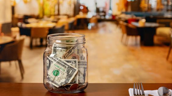 Tip jar in restaurant dining room