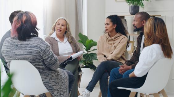 small circle of people discussing