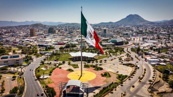 Panoramic view of Chihuahua with Mexican flag