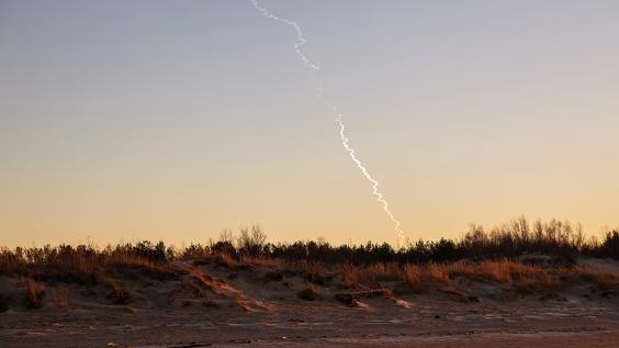 Missile trail in sky