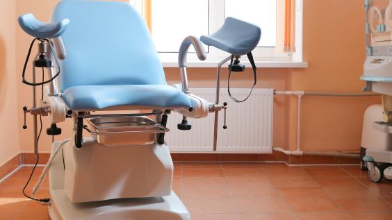 Gynecological exam chair in doctor's office