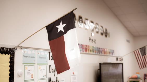 Texas and American flags displayed in pre-kindergarten classroom.
