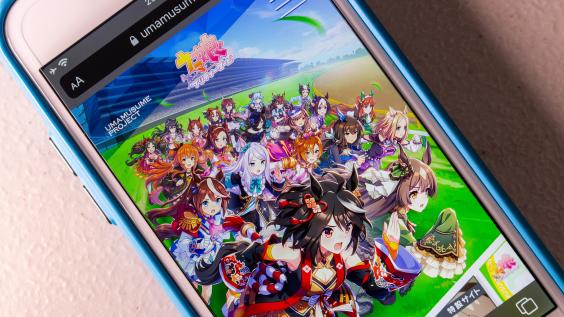 image of anime game on a mobile phone