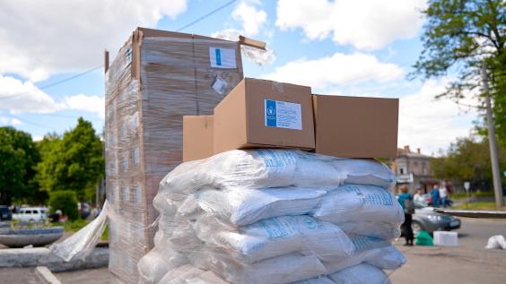 Humanitarian food aid unloaded in front of humanitarian center.