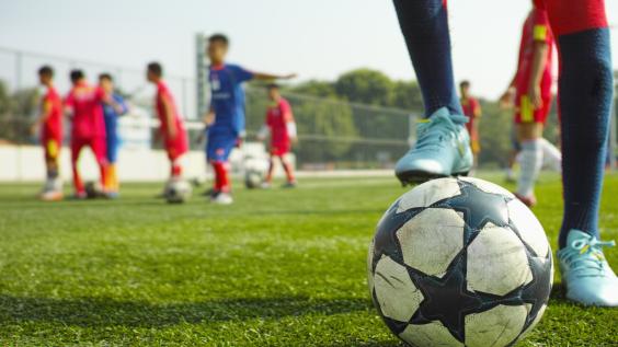 Child playing soccer