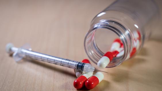 Pills and syringe