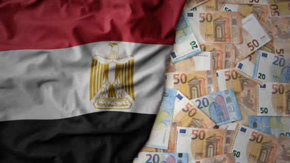 Egyptian flag on the left on top of a layer of Euro notes