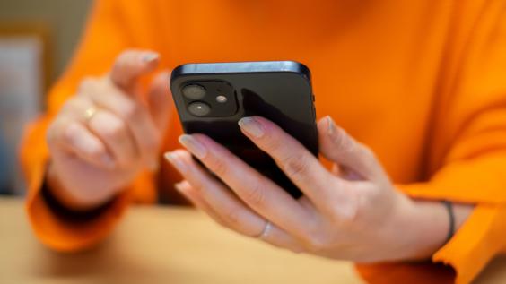 Person scrolling through cellphone