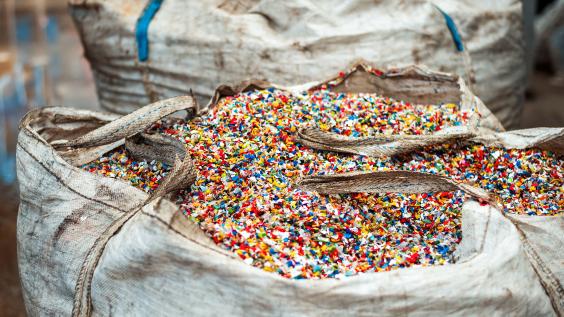Shredded plastic garbage at waste recycling factory
