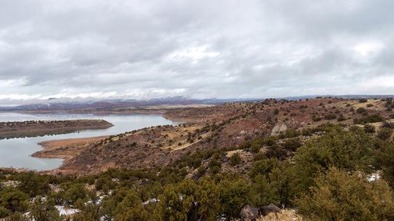 Red rocks around a reservoir