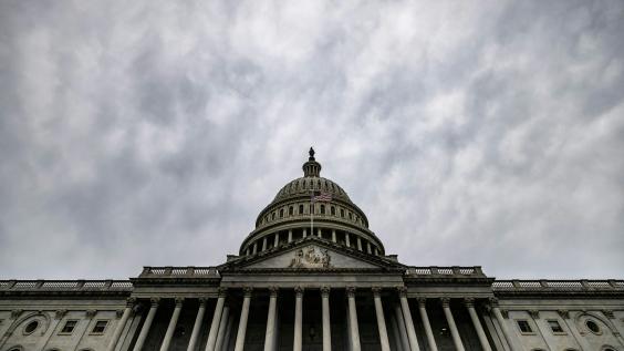 U.S. Capitol with grey sky above