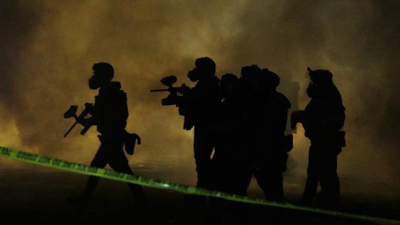 riot police amid smoke