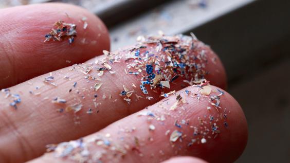 Close up side shot of microplastics lay on hand