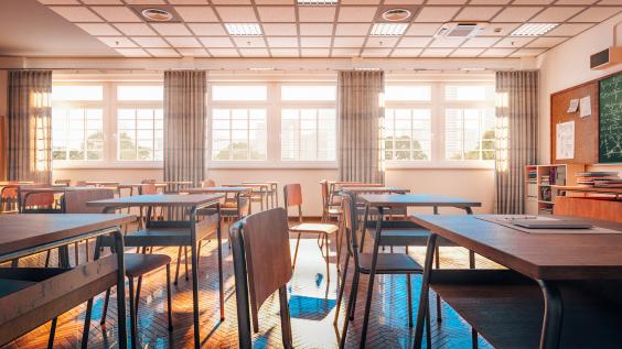 high school classroom with desks/tables and chairs