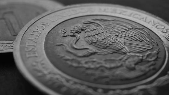 Coin of 5 Mexican pesos close-up. Peso of Mexico. Reverse of coin with coat of arms of country. 