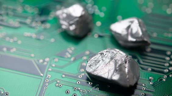 rare mineral rocks on green circuit board