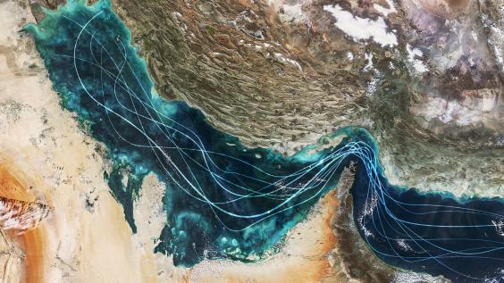 Satellite view of the Persian Gulf and Strait of Hormuz with glowing blue lines symbolizing naval traffic and strategic maritime routes amidst geopolitical tensions and regional conflict in Iran.