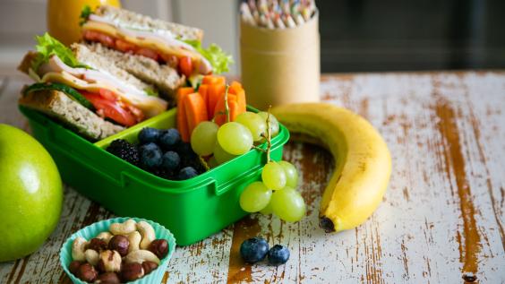 Packed school lunch on kitchen background