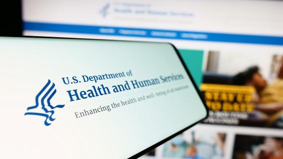 Mobile phone with logo of American Department of Health and Human Services (HHS)