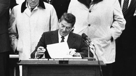 President Ronald Reagan signing bill