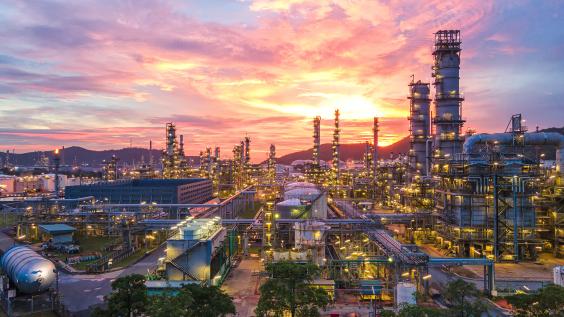 oil refinery at sunset