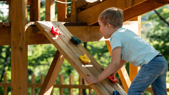 Child at play on colorful playground equipment