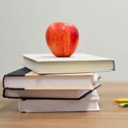 Apple on top of stack of books