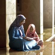 Mother and daughter reading book