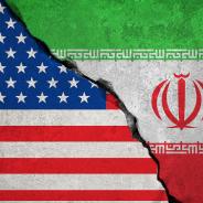 The flags of the U.S. and Iran fusing together as stone.