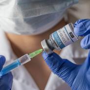A medical worker fills a syringe with the COVID-19 vaccine 