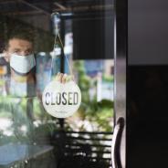 A man closes his business due to the COVID-19 pandemic.