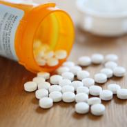 Prescription opioid medication pills spilled onto table