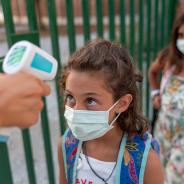 Student gets temperature checked at school