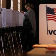 Woman casting her vote at the polls.
