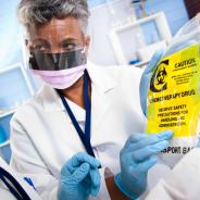 Doctor administering chemotherapeutic drugs